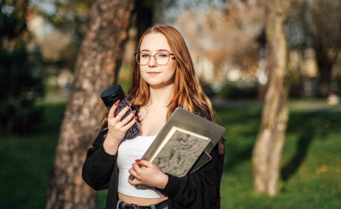 woman focused on her studies about to enter classes